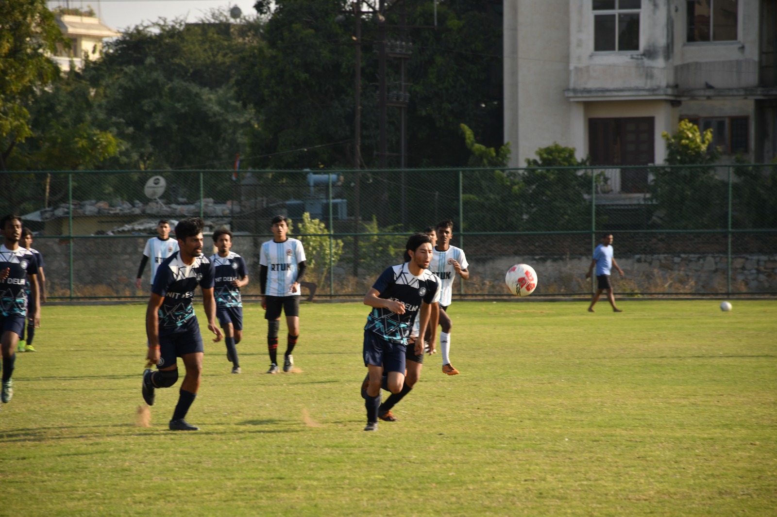 Intense football match under bright stadium lights