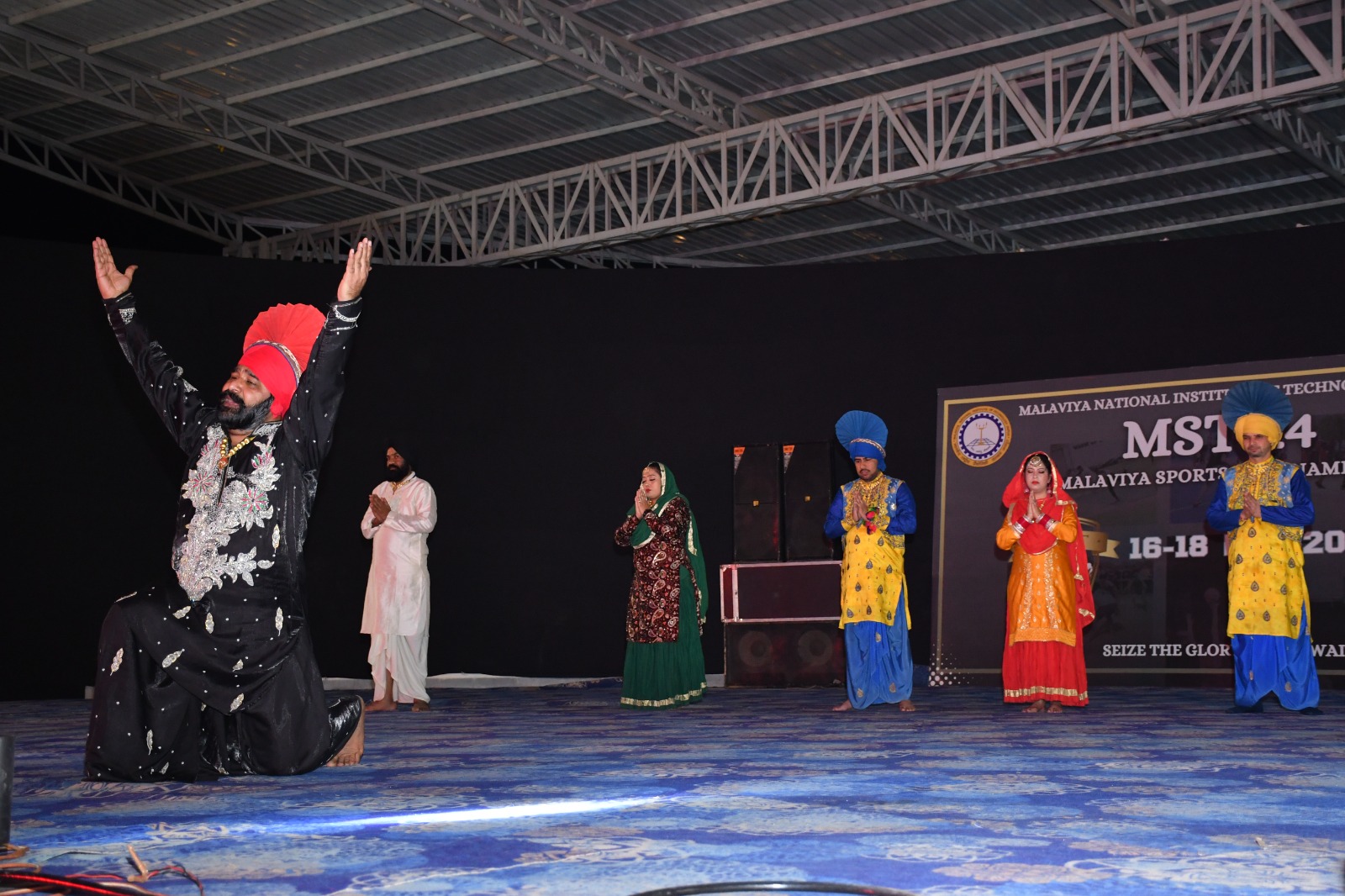 A lively crowd enjoying vibrant cultural performances